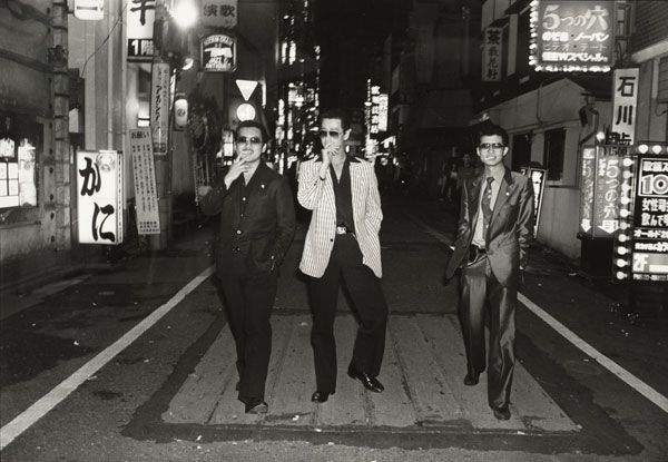 Katsumi Watanabe, Untitled [Three men with cigarettes, posing in the street], ca. 1970, printed 1985; Promised gift of Paul Sack to the Sack Photographic Trust © Estate of Katsumi Watanabe 