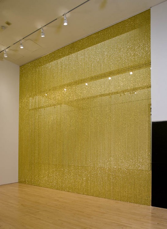 Felix Gonzalez-Torres, "Untitled" (Golden), 1995; strands of beads and hanging device, dimensions variable; Collection SFMOMA, Collection of the San Francisco Museum of Modern Art, through prior gifts of J. D. Zellerbach, Gardner Dailey, and an anonymous donor; the Solomon R. Guggenheim Museum, New York, through prior gift of Solomon R. Guggenheim; and the Art Institute of Chicago, through prior gift of Adeline Yates; partial gift of Andrea Rosen in honor of Felix Gonzalez-Torres; © The Felix Gonzalez-Torres Foundation Felix Gonzalez-Torres, "Untitled" (Golden), 1995