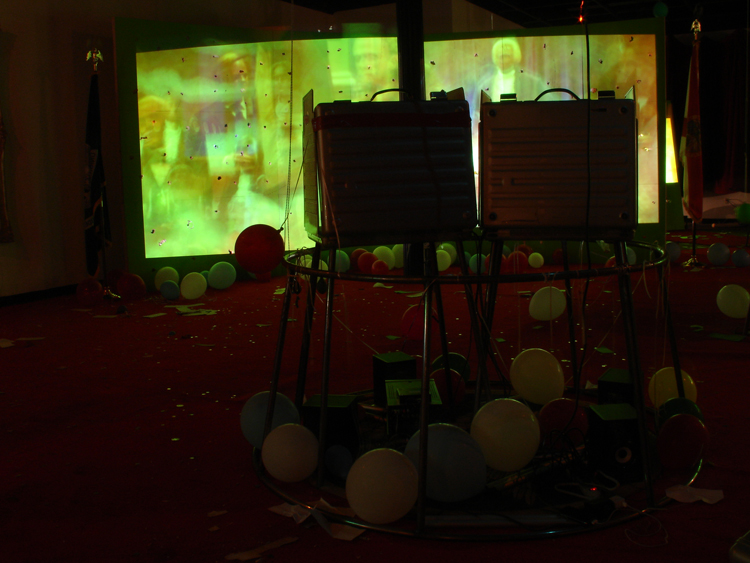 Stephen G. Rhodes, Interregnum Restoration Repetition (Who Farted!!??!??!!!?!), 2008; two channel video, mixed media and voting booths, dimensions variable; installation view, Prospect.1 New Orleans, 2008; courtesy the artist and Galerie Isabella Bortolozzi, Berlin Stephen G. Rhodes, Interregnum Restoration Repetition (Who Farted!!??!??!!!?!), 2008; two channel video, mixed media and voting booths, dimensions variable; installation view, Prospect.1 New Orleans, 2008; courtesy the artist and Galerie Isabella Bortolozzi, Berlin