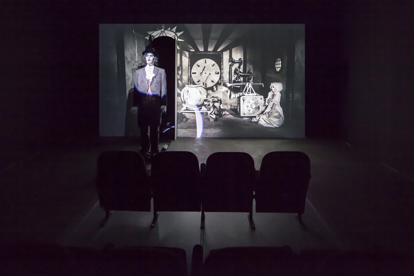 John Bock, Der magische Krug, 2013; animated puppets, canvas, cinema seats; projection: 259 x 485 x 200 cm, cinema seats: 125 x 250 x 250 cm; installation view, John Bock, 'Knick-Falte in der Schädeldecke', Sprüth Magers, Berlin, March 15 - April 12, 2014; © John Bock, courtesy Sprüth Magers John Bock, Der magische Krug, 2013; animated puppets, canvas, cinema seats; projection: 259 x 485 x 200 cm, cinema seats: 125 x 250 x 250 cm; installation view, John Bock, 'Knick-Falte in der Schädeldecke', Sprüth Magers, Berlin, March 15 - April 12, 2014; © John Bock, courtesy Sprüth Magers