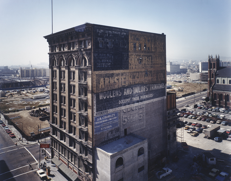 Janet Delaney, Mercantile Building, c. 1903, with a view toward the Moscone Center construction site, from the series South of Market, 1978-1986, 1980, printed 1998; chromogenic print, 15 in. x 19 in. (38.1 x 48.26 cm); Collection SFMOMA, Accessions Committee Fund purchase; © Janet Delaney Janet Delaney, Mercantile Building, c. 1903, with a view toward the Moscone Center construction site, from the series South of Market, 1978-1986, 1980, printed 1998
