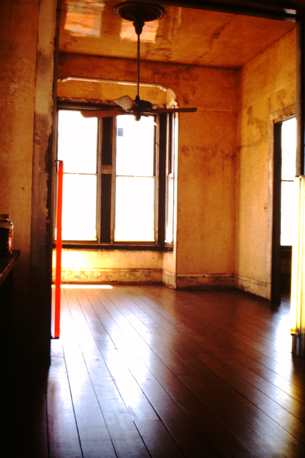 View of front parlor room at 500 Capp Street, with applied polyurethane varnish on the walls and ceiling, c.1977; photo: David Ireland; image courtesy of The 500 Capp Street Foundation.