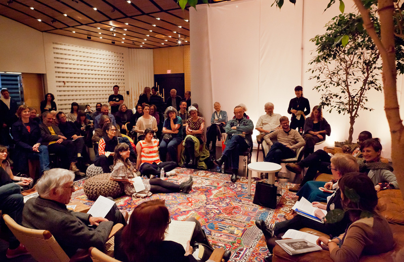 Semi-circle of speakers starting with Joe Goode (in jean jacket and jeans); Joshua Kit Clayton, Barry Jenkins, Margaret Tedesco, Terry Castle, Lindsey Boldt, Marion Gray, Richard O. Moore. On poofs in center of the room: Georgie Devereaux, Amy Trachtenberg, Dana Cohen.