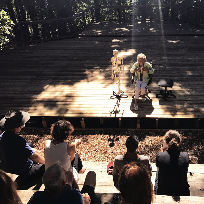 Anna Halprin shares instructions for a seated movement improvisation on the dance deck, July 26, 2017. Photo by Sophia Wang.