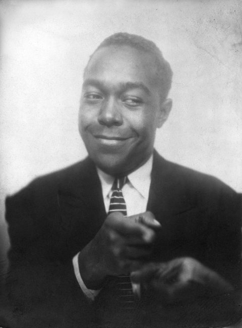 Charlie Parker in a photo booth, Kansas City, 1940.