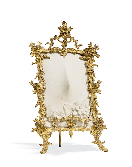 Meret Oppenheim, Miss Gardenia, 1962; plaster in metal frame with metallic paint, 10 5/8 in. x 6 1/2 in. x 4 1/4 in. (26.99 cm x 16.51 cm x 10.8 cm); Collection SFMOMA, Helen Crocker Russell Memorial Fund purchase; © Artists Rights Society (ARS), New York / ProLitteris, Zürich Meret Oppenheim, Miss Gardenia, 1962; plaster in metal frame with metallic paint, 10 5/8 in. x 6 1/2 in. x 4 1/4 in. (26.99 cm x 16.51 cm x 10.8 cm); Collection SFMOMA, Helen Crocker Russell Memorial Fund purchase; © Artists Rights Society (ARS), New York / ProLitteris, Zürich