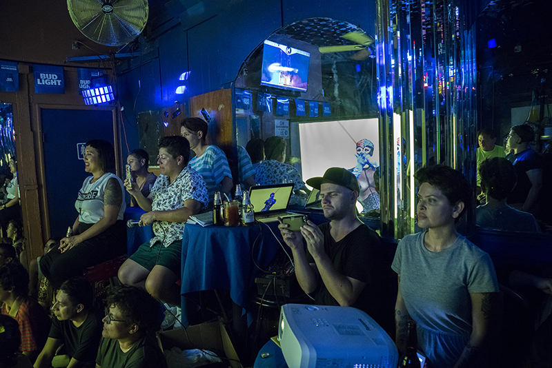 A public gathers for Dirty Looks On Location’s presentation of All the Films of Xandra Ibarra at Redz Angelz Bar in Boyle Heights. Photo: Amina Cruz.