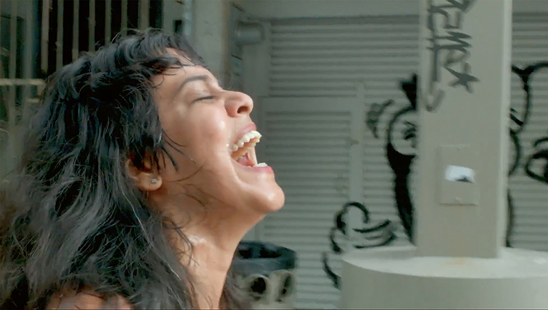 Xandra Ibarra, performance video still from Nude Laughing in San Juan, Puerto Rico, 2016. Video documentation by Adrian Perez.