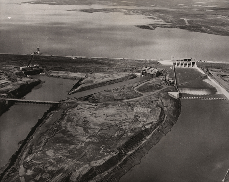 Unknown, Airview of new dam, 1953. Falcon Dam on the Rio Grande, with hydroelectric plants on both the US side and the Mexican side. Source: Library of Congress.