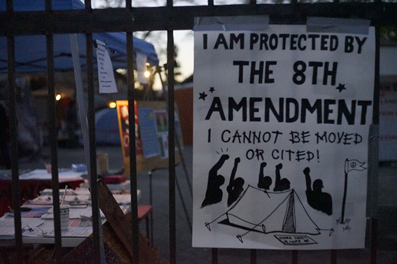 A sign on the gate at The Village in Deep East Oakland.
