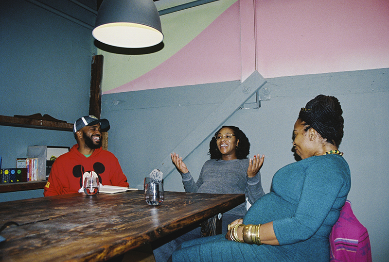 Pendarvis Harshaw, Talia Taylor, and Candice Antique sitting around a table at Sprinkle Lab in West Oakland. Photo: Sasha Kelly.