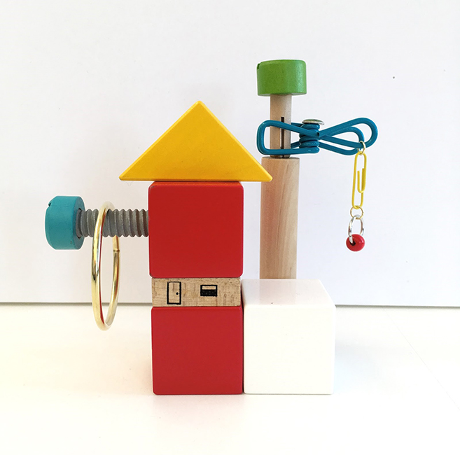 Casual Learning Environment No. 11, 2018; wood blocks and toys, clip, metal rings, thumb tack, paper clip, 5.75" x 6" x 2.5"