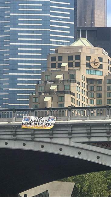 Banner dropped off a bridge in Melbourne.