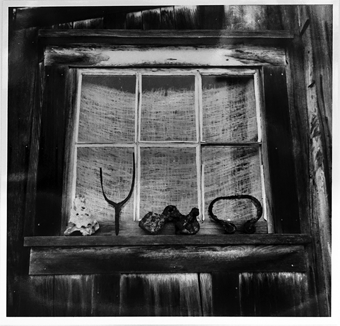 Exterior shot of bunkhouse window with artifacts from Richardson Bay. From the Dave Lemon and Jerry O’Day collection.
