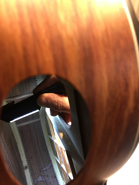 A framework of interlocked, small wood bars. They support a soundboard that is less than half the thickness of a conventional one.