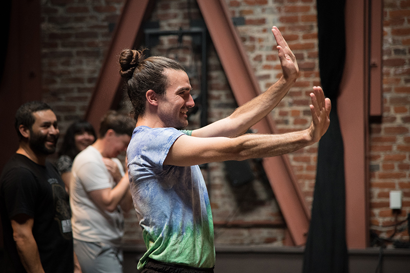 Silias Riener leading morning class at the Signals from the West workshop. Commissioned artists Alex Escalante, Danishta Rivera, and Maxe Crandall in the background. Photo: Hillary Goidell.