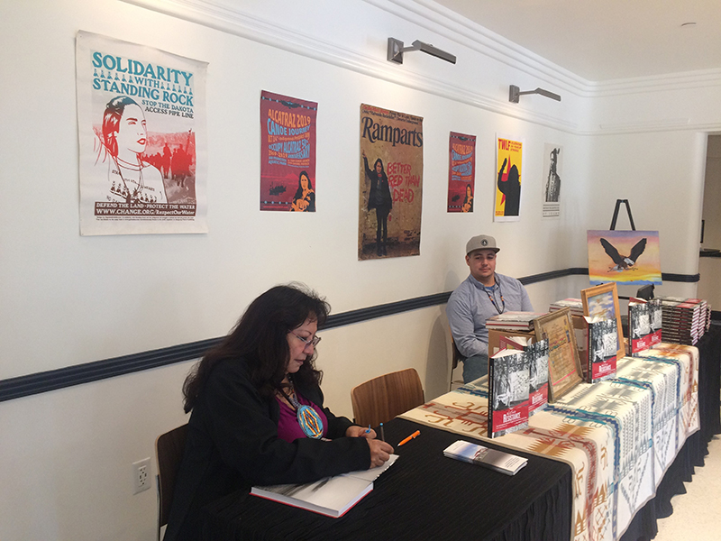LaNada War Jack signing copies of Native Resistance. Photo: Claudia La Rocco.