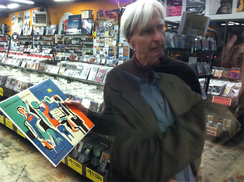 Jerome Hiler looking out the window of a record store, 2016. Photo: Nathaniel Dorsky.