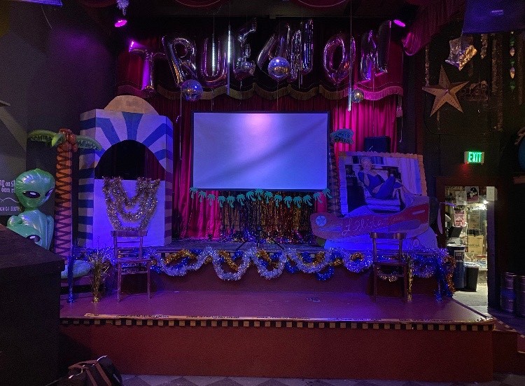 The stage set for TrueAnon's November 21, 2019 event at Make Out Room. Courtesy TrueAnon Pod.
