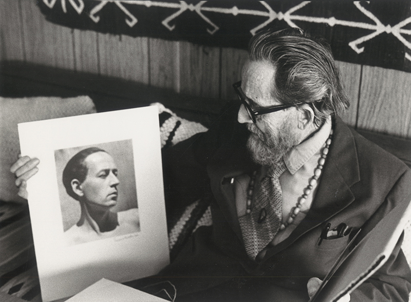 Dane Rudhyar looking at an Edward Weston portrait of himself in the 1920s (exact date unknown). Photo: Betty Freeman. © Los Angeles Philharmonic Association.