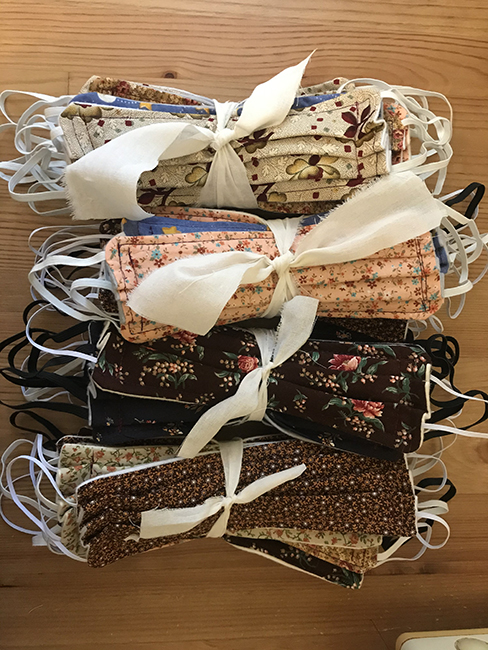 Bundles of masks made from Allison Smith's fabric remnants.