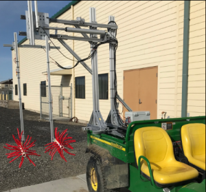 Small fiber heads are suspended on a back of an ATV. 