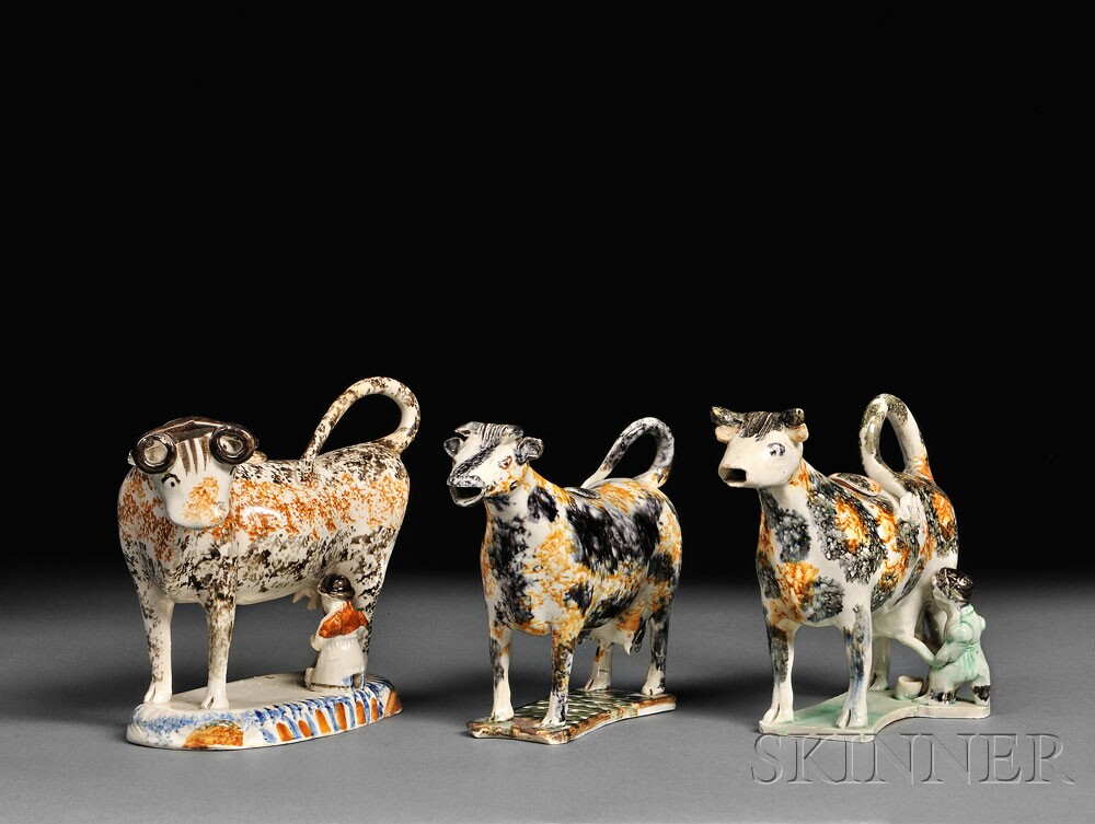 Examples of Staffordshire Earthenware Cow Creamers (Lots 1270, 1102, and 1269, estimates $500-$700 and $400-$600)