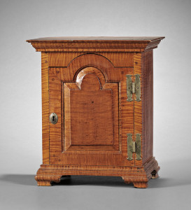 Chester County, Pennsylvania carved tiger maple spice chest, c. 1780, sold for $23,700 at Skinner in 2010