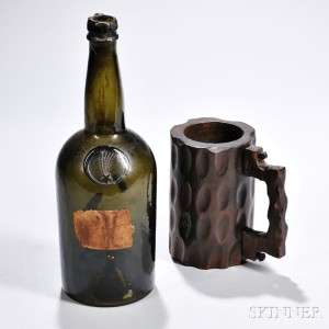 Carved Mug from the Maststep of the America, and an Early Blown Glass Bottle, early and mid-19th century (Lot 1142, Estimate $1,500-$2,500)