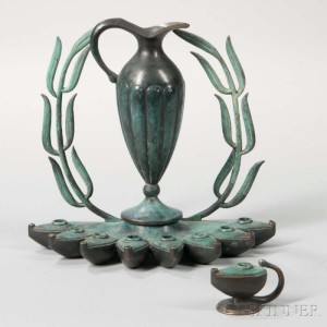 Pal-Bell Patinated Bronze Hanukkah Lamp, designed by Maurice Ascalon, Jerusalem, c. 1950. Recognizable with the references to Roman lamps and the patination of ancient bronzes the design is closely associated with early statehood.