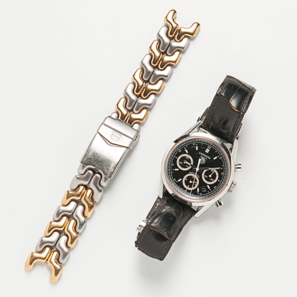 The Motorist - Tag Heuer Carrera Mens Wristwatch, Lot 1207 - Heuer’s representation on the wrists of Formula One racing greats is unparalleled. The recipient of this Carrera will feel like he’s in the driver’s seat next to Niki Lauda, Al Unser, and Jo Siffert, all of whom have sported Heuer chronographs.