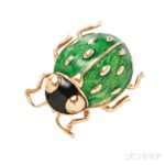 18kt Gold and Enamel Pin, Cartier (Lot 1028, Estimate $400-600)