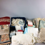 Large Group of Linens and Textiles, including napkins, placemats, and tablecloths, some solid colors and some with patterns. (Lot 2318, Estimate: $200-300)
