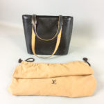 Louis Vuitton Stockton Noir Bag, with embossed logo, dust cover, and original receipt. (Lot 2321, Estimate: $200-300)