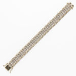 9kt Gold and Diamond Bracelet, set with full-cut diamonds, approx. total wt. 5.00 cts., 15.3 dwt, lg. 7 1/8 in. (Lot 2000, Estimate: $600-800)