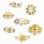 Group of Art Nouveau Gold Floral Brooches, most enameled, set either with diamonds or pearls, wd. 1 3/8 in., total 12.5 dwt. (Lot 2040, Estimate: $400-600)