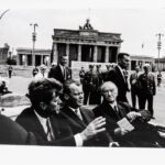 Will McBride (American, 1931-2015) <i>John F. Kennedy, Willy Brandt, Konrad Adenauer after visiting the Wall at the Brandenburg Gate, Berlin 1963</i>. (Lot 1017, Estimate: $400-600)