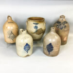Four Cobalt-decorated Stoneware Jugs and a Crock (Lot 1250, Estimate: $300-500)