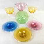 Six Cowdy Glass Workshop Plates and Three Bowls (lot 1368, Estimate: $20-200)