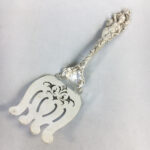 Reed & Barton "Love Disarmed" Pattern Asparagus Server (Lot 1106, Estimate: $200-400)