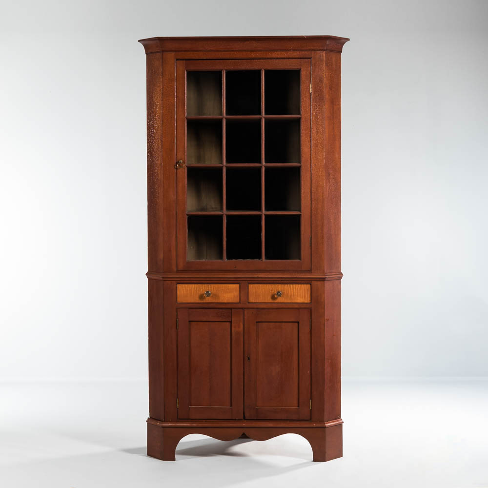 Glazed Cherry and Tiger Maple Corner Cupboard, probably Pennsylvania (Lot: 1099, Estimate: $1,000-1,500)