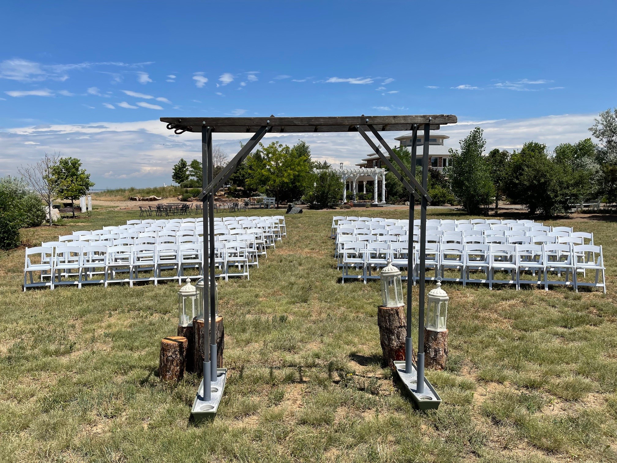 7 Colorado Rustic Barn Venues for Weddings Near Me for a Country Chic Celebration 1 Country wedding ceremony location with rustic wedding arch