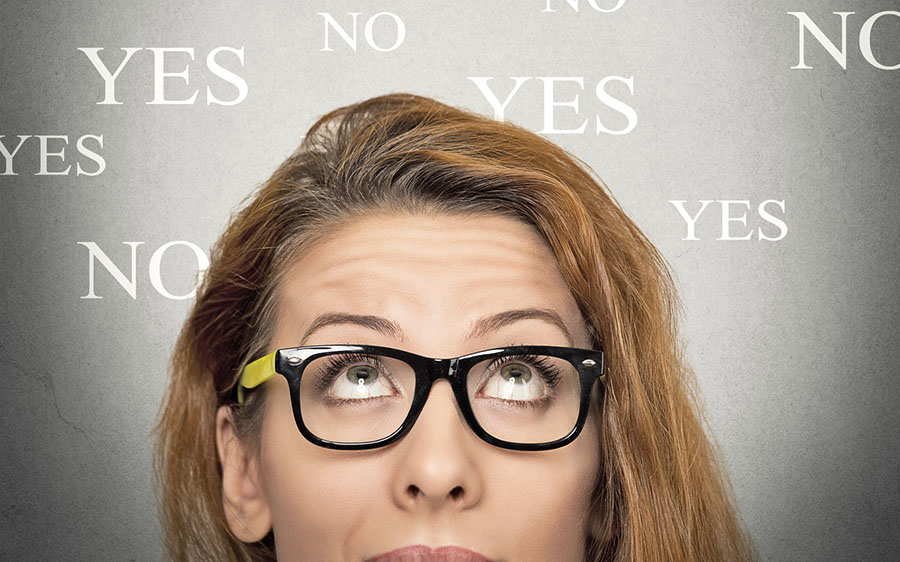 uncertain woman looking up, background with yes no choices