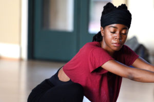 A member of the Chocolate Heads Movement Band rehearses for "Ghost Architecture," for "Ghost Architecture," a November 2016 site-specific piece in Roble Gym.