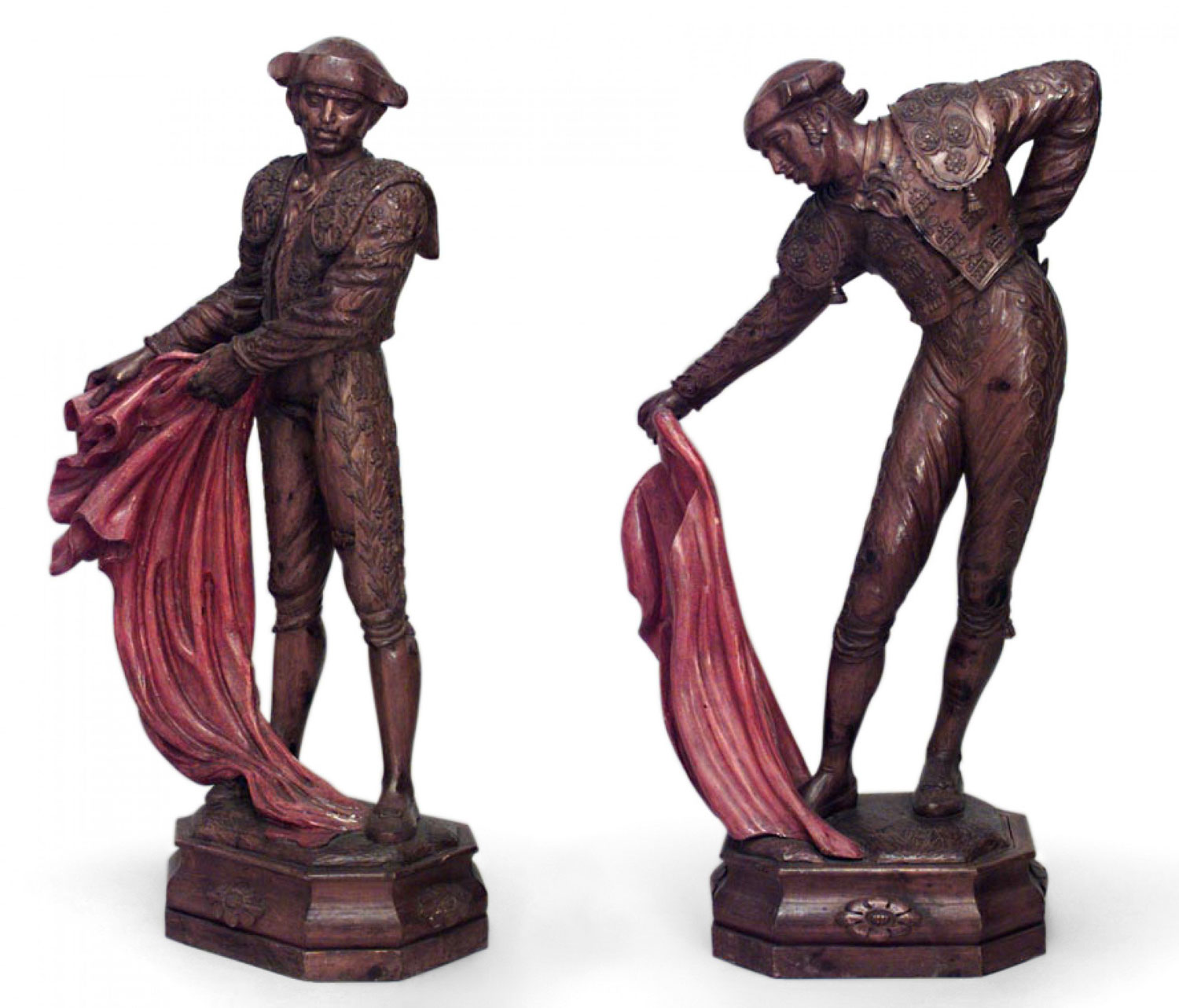 Carved pine toreadors with red capes 1