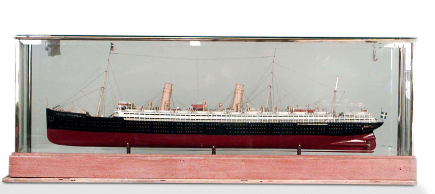 German luxury liner ship model in glass case
