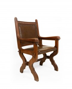 English gothic walnut and leather armchair