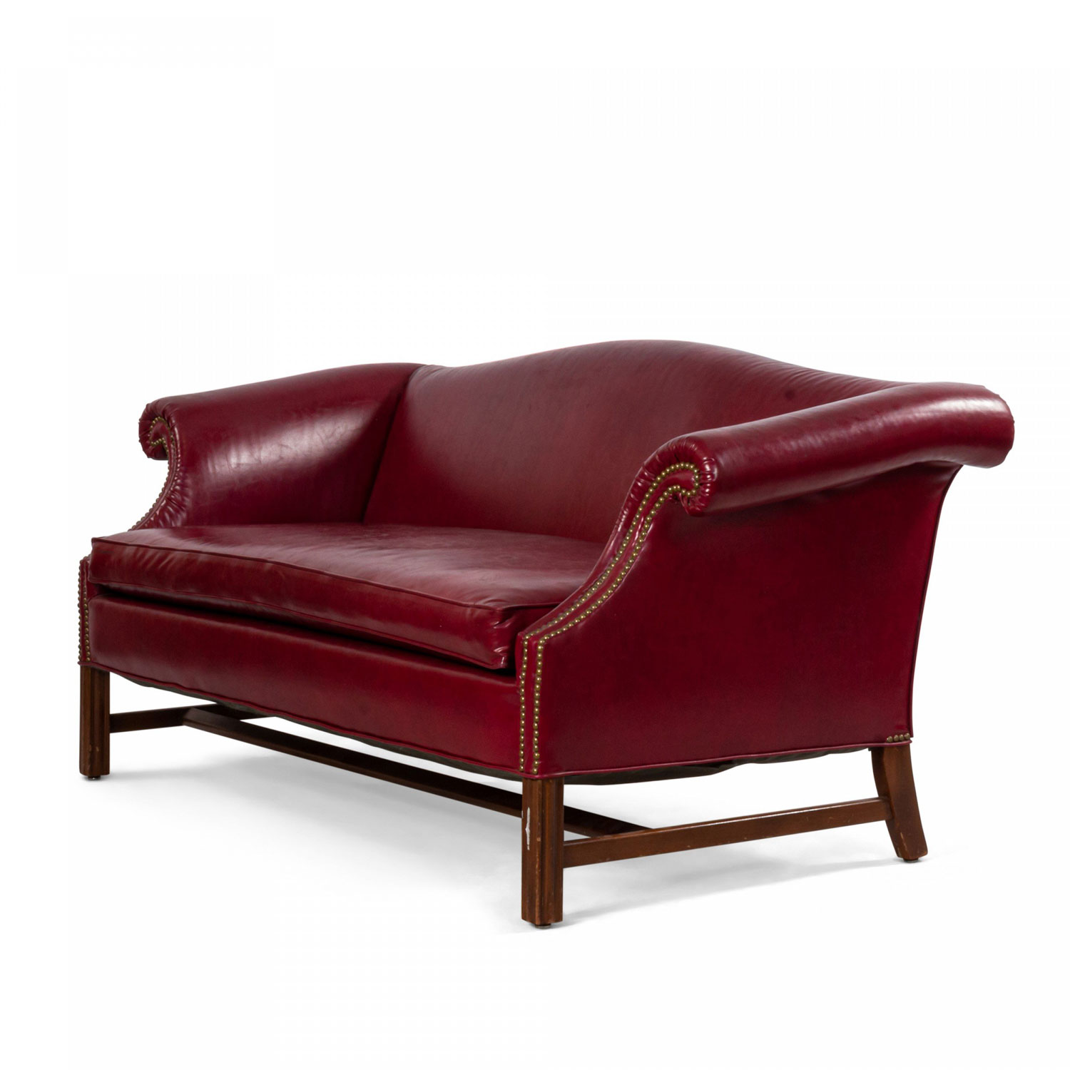 Dark red leather sofa with upholstery stud detail