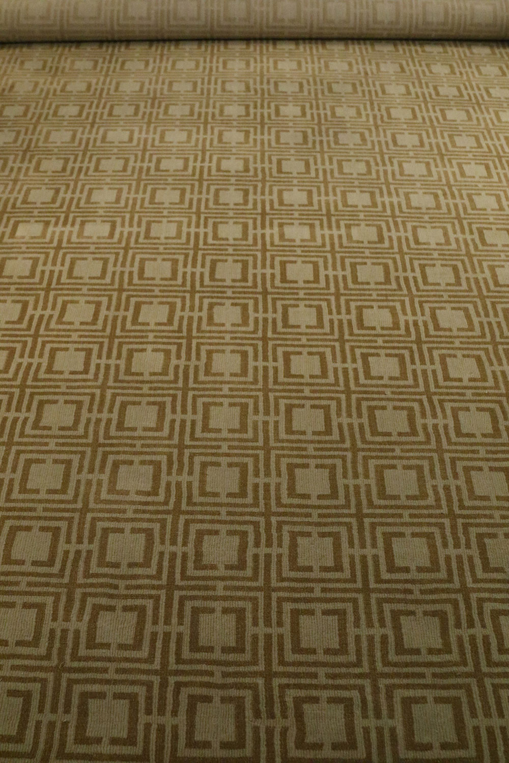 Contemporary gold and brown geometric patterned area rug