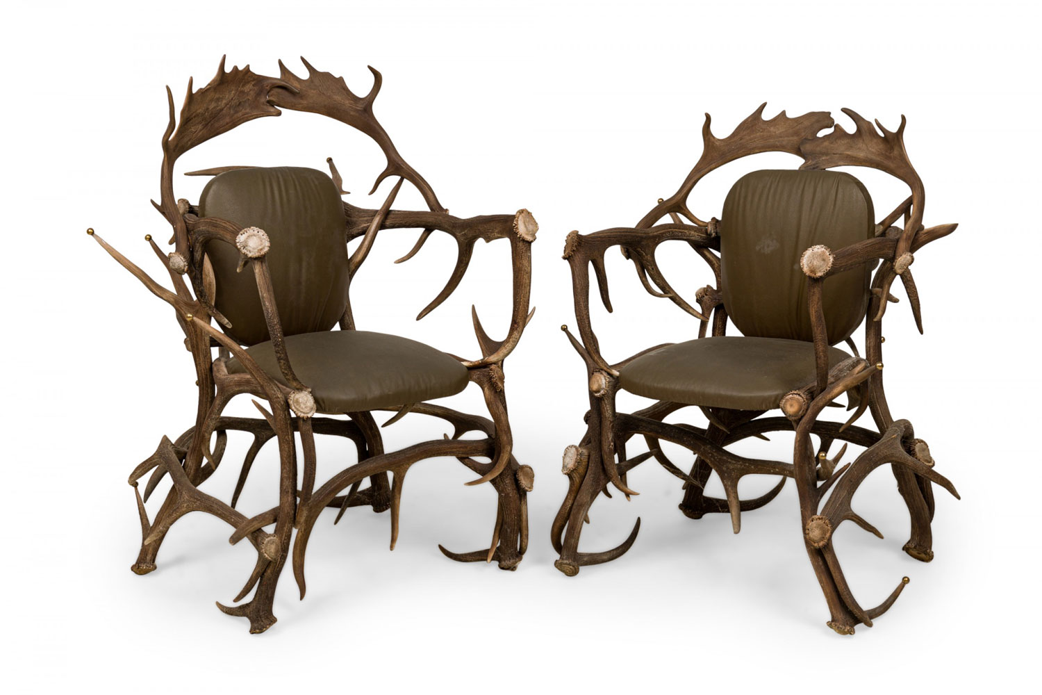 Pair of rustic continental style dark olive green leather and faux antler armchairs